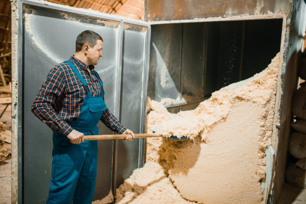 Loose-fill insulation being cleared